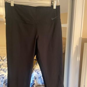 Cropped womens Nike dri-fit legging with mesh side panel